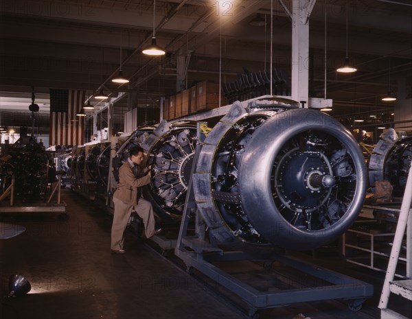 Cowling and control rods are added to motors for...North American Inc., Inglewood, Calif., 1942. Creator: Alfred T Palmer.