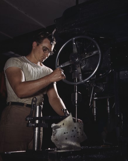 An employee in the drill-press section of North American's huge machine..., Inglewood, Calif. , 1942 Creator: Alfred T Palmer.