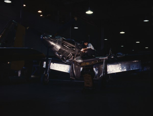 P-51 ("Mustang") fighter plane in construction, North American Aviation, Inc., LA, Calif. , (1942?). Creator: Alfred T Palmer.