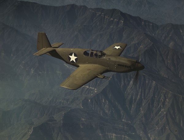 P-51 "Mustang" fighter in flight, Inglewood, Calif. , 1942. Creator: Alfred T Palmer.