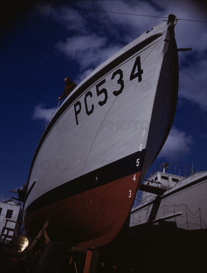 Another harrier of the U-boats nears completion..., Marine Construction Co., Stamford, Conn. , 1942. Creator: Howard Liberman.