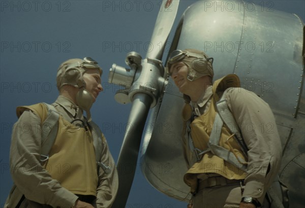 Marine lieutenants, pilots, by the power tow-plane...Parris Island's Page Field, S.C., 1942. Creator: Alfred T Palmer.