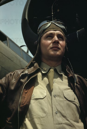 U.S. Army Air Forces pilot in front of a YB-17 bombing..., probably Langley field, Virginia, 1942. Creator: Alfred T Palmer.