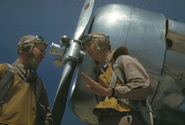 Marine lieutenants, pilots, by the power tow-plane for the...Page Field, Parris Island, S.C., 1942. Creator: Alfred T Palmer.