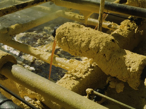 Melted sulphur from the wells pouring into relay..., Freeport Sulphur Co, Hoskins Mound, Texas, 1943 Creator: John Vachon.