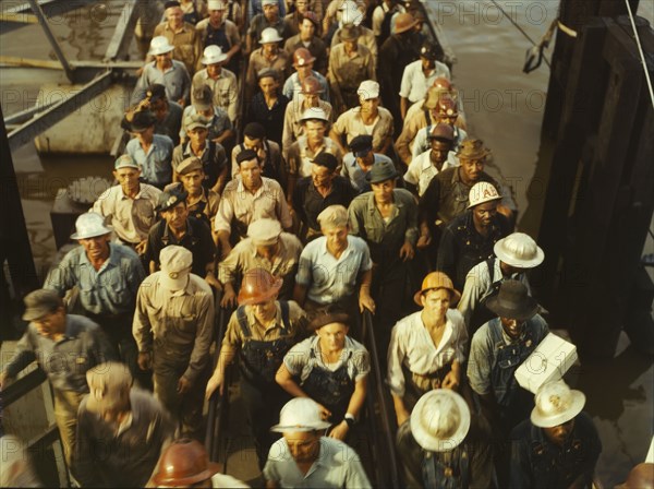 Workers leaving Pennsylvania shipyards, Beaumont, Texas, 1943. Creator: John Vachon.