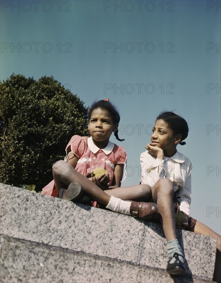 Two little girls in a park near Union Station, Washington, D.C., ca. 1943. Creator: Unknown.