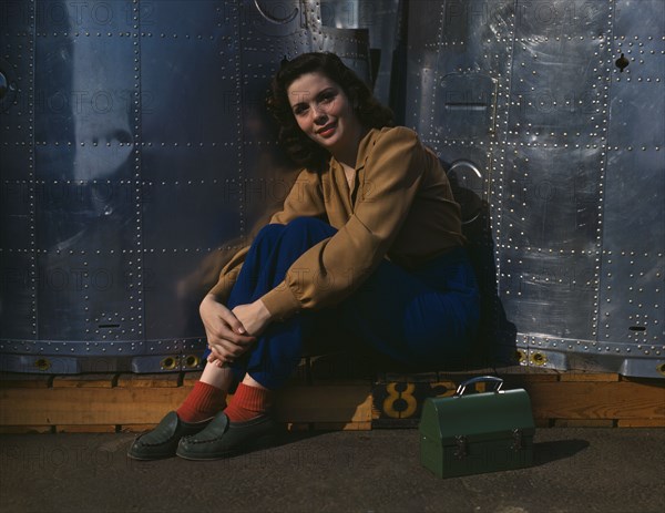 A noontime rest for a full-fledged assembly worker...Long Beach, Calif. Plant of Douglas..., 1942. Creator: Alfred T Palmer.