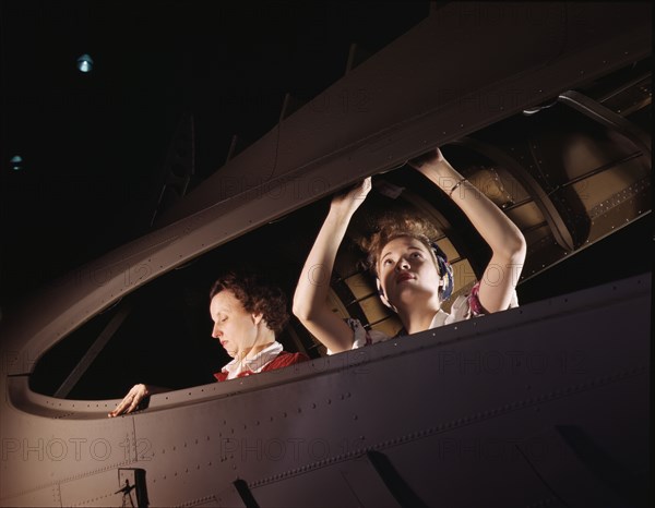 American mothers and sisters, like these women at the Douglas Aircraft..., Long Beach, Calif. , 1942 Creator: Alfred T Palmer.