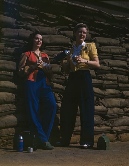 Lunchtime brings a few minutes of rest...Douglas Aircraft Company's plant, Long Beach, Calif. , 1942 Creator: Alfred T Palmer.