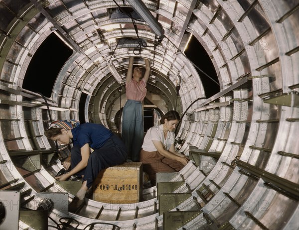 Women workers install fixtures and assemblies...Douglas Aircraft Company, Long Beach, Calif. , 1942. Creator: Alfred T Palmer.