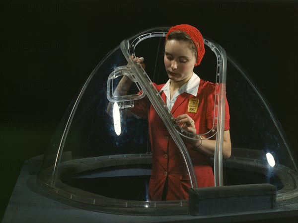 This girl in a glass house is putting finishing touches..., Long Beach, Calif. , 1942. Creator: Alfred T Palmer.