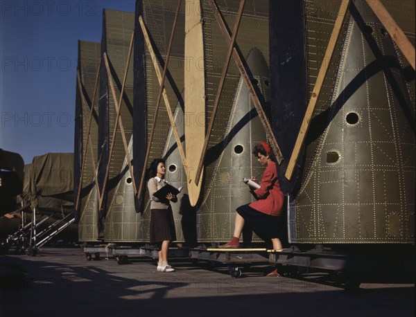 Carefully trained women inspectors check and..., Douglas Aircraft Company, Long Beach, Calif., 1942. Creator: Alfred T Palmer.