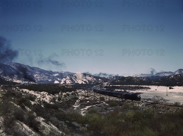 Santa Fe R.R. trains going through Cajon Pass in the San Bernardino Mountains, Cajon, Calif., 1943. Creator: Jack Delano.
