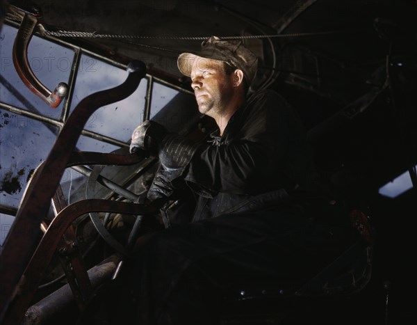 Crane operator at TVA's Douglas Dam, Tennessee, 1942. Creator: Alfred T Palmer.