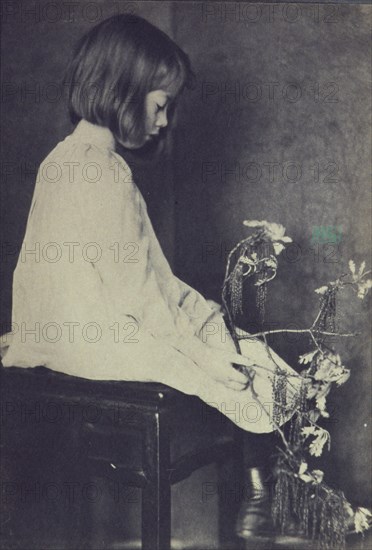 Child with oak branch, c1900. Creator: Eva Watson-Schutze.