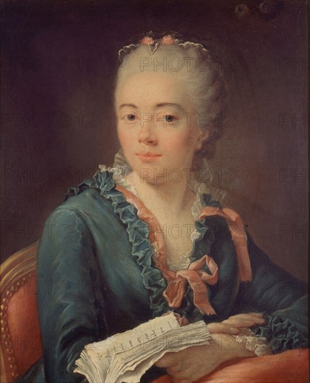 Portrait of a woman holding a book.