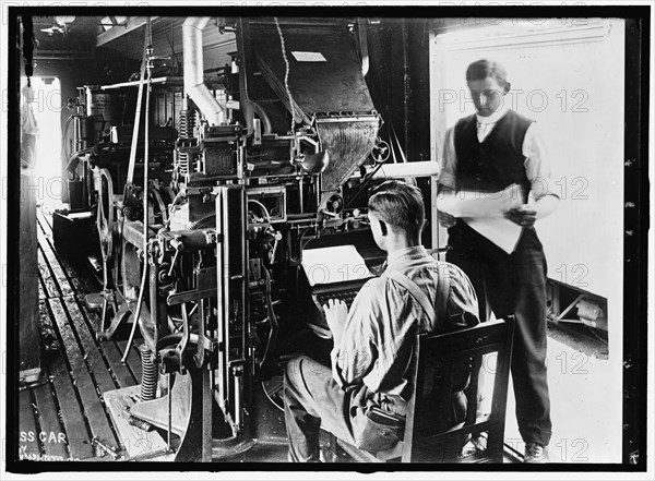 G.N. Press Car, between 1913 and 1918. Men in printing works.