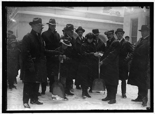 Group outside White House in snow, between 1913 and 1918.