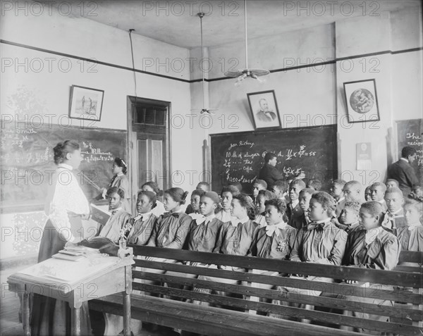 Mathematics class at Tuskegee Institute, 1906. [Young black women learning maths].