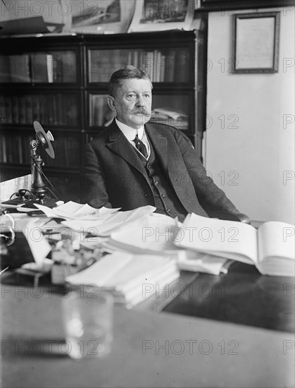 Edward B. Moore, Commissioner of Patents - At Desk, 1912. Creator: Harris & Ewing.