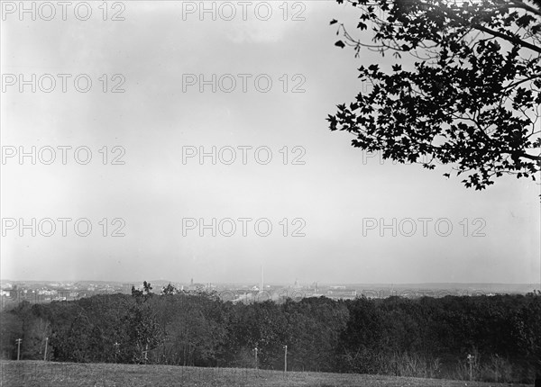 Arlington National Cemetery - View, Washington In Distance, 1912. Creator: Harris & Ewing.