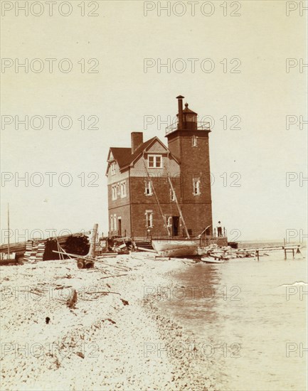 View of lighthouse from beach, Duluth, Minn., 1903.