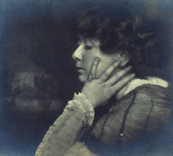Woman resting her head on her left hand, head-and-shoulders profile portrait, c1900. Creator: Unknown.