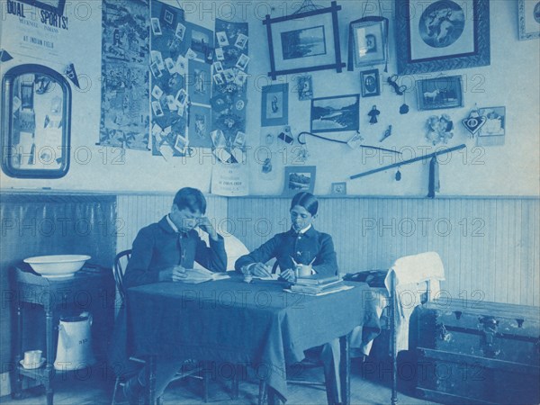 Carlisle Indian School, Carlisle, Pa. Two boys studying in dormitory room, 1901.