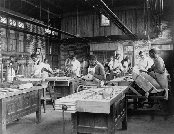 Young men training in wheel wrighting at Hampton Institute, Hampton, Virginia, 1899 or 1900.