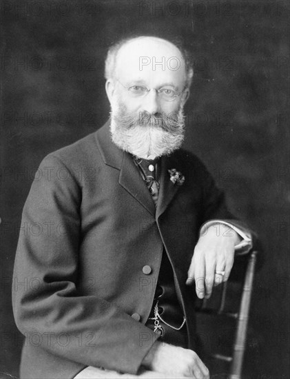 Col. William H. Crook, a White House employee, half-length portrait, seated, facing front, between 1890 and 1910.