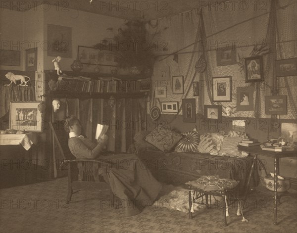 Miss Foster, faculty at Carlisle Indian School, full length, reclining in chair, reading a book, between 1901 and 1903.
