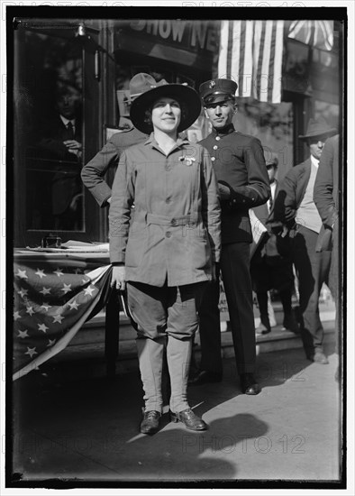 Dora Rodrigues, recruiter for service branches, possibly in front of the Cosmos Theater..., May 1917 Creator: Harris & Ewing.