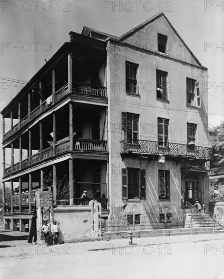 Front and side view of apartment(?) house, 61 Washington Street, Charleston, South Carolina, between 1933 and 1940.