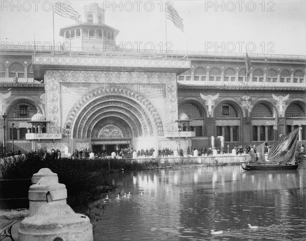 Transportation exhibit building with canal boat and ducks on canal(?) in foreground..., 1893. Creator: Frances Benjamin Johnston.