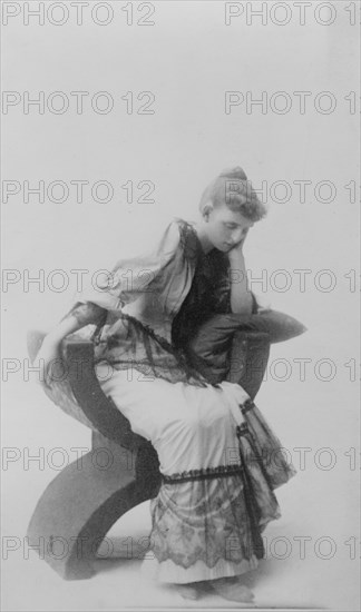 Frances Benjamin Johnston, full-length portrait, seated, facing left, looking..., c1880 - 1890. Creator: Unknown.