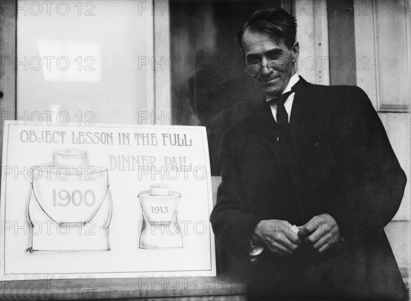 Theron Akin, Rep. from New York; with 'Full Dinner Pail' Placard, 1913. Creator: Harris & Ewing.