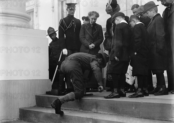 Boy Scouts - Visit of Sir Robert Baden-Powell To D.C. Making Fire; Mrs. Taft Watching, 1911. Creator: Harris & Ewing.