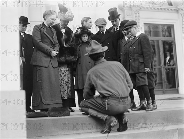 Boy Scouts - Visit of Sir Robert Baden-Powell To D.C. Making Fire; Mrs. Taft Watching, 1911. Creator: Harris & Ewing.