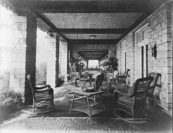 Porch of E.C. Converse house, with wicker furniture, Greenwich, Connecticut, 1908. Creator: Frances Benjamin Johnston.