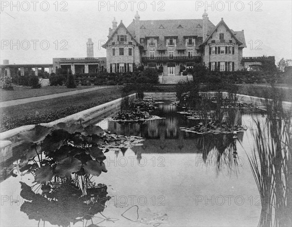 Facade of home of Edmund Cogswell Converse, with lily pond in..., Greenwich, Connecticut, 1908. Creator: Frances Benjamin Johnston.