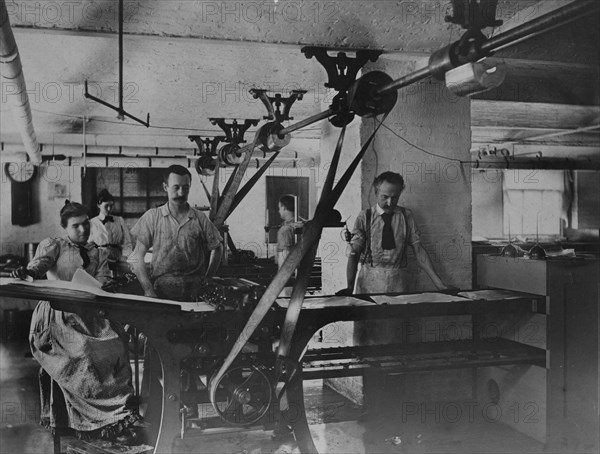 Workers in the postage stamp gumming and drying room in the Stamp Division..., ca 1895. Creator: Frances Benjamin Johnston.