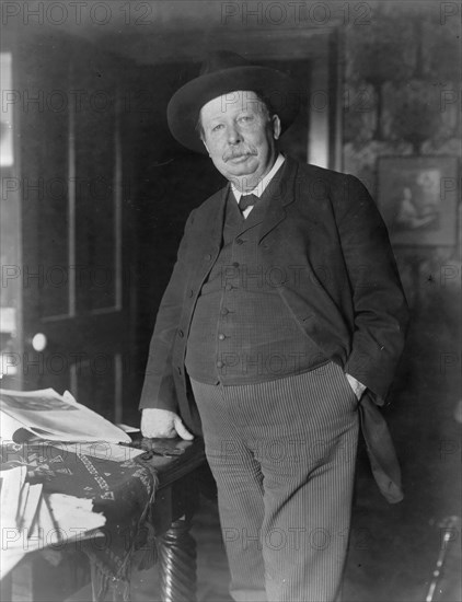 Joel Chandler Harris, three-quarter-length portrait, standing, facing slightly left, c1890 and 1910. Creator: Frances Benjamin Johnston.