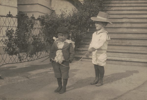 Quentin Roosevelt and Roswell Pinckney at play, c1902 June 17. Creator: Frances Benjamin Johnston.