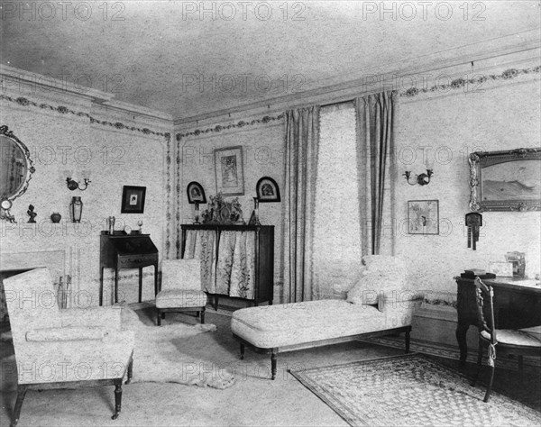 Bedroom with fireplace, padded chaise longue, window, and polar..., Greenwich, Connecticut, 1908. Creator: Frances Benjamin Johnston.