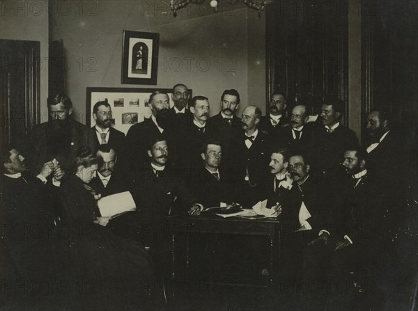 Frances Benjamin Johnston, seated in profile at left, group portrait with 18..., c1880 - 1900. Creator: Frances Benjamin Johnston.