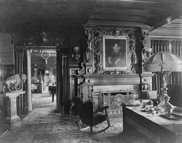 Study with portrait of woman in Elizabethan dress, over fireplace..., Greenwich, Connecticut, 1908. Creator: Frances Benjamin Johnston.