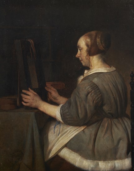 Woman in the mirror, c.1662.