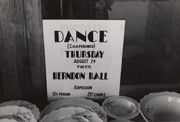 Poster in drugstore window, Syracuse, Kansas, 1939-08.