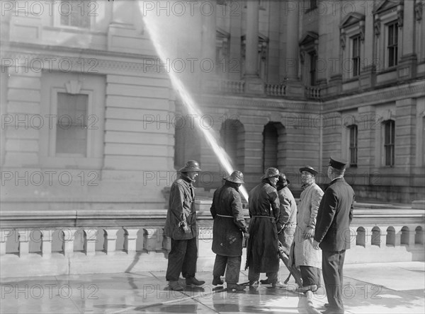 U.S. Capitol - Cleaning Exterior, 1913. Creator: Harris & Ewing.